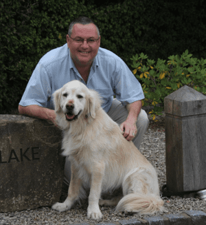 John Farrell with golden retriever