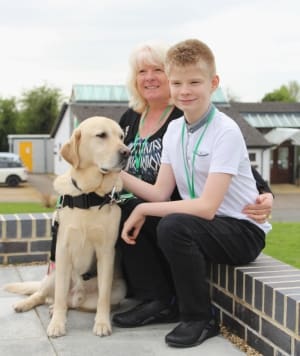 Joel and Janet with autism assistance dog Caddie