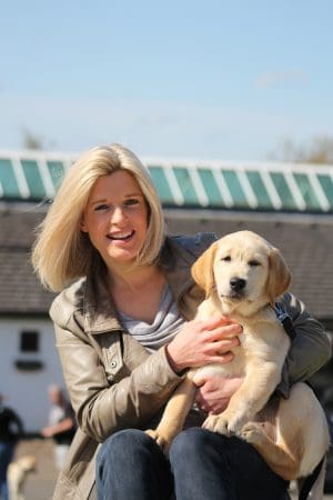 sarah stirk with assistance dog puppy