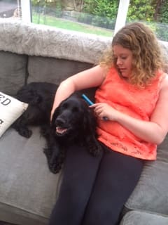 girl cuddles assistance dog