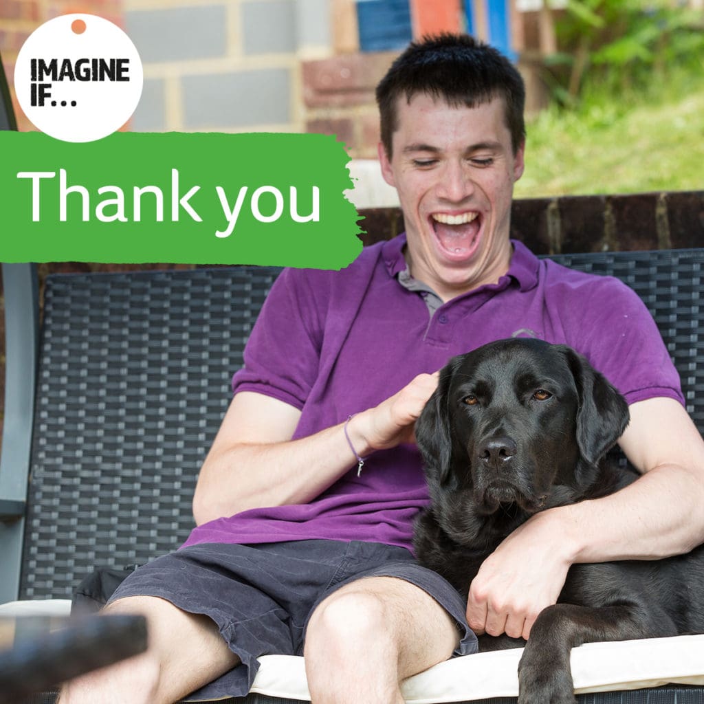 Joel and his assistance dog Harry, with a thank you message