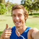 Cropped portrait of an athletic young sportsman listening to music while out for a jog in the park