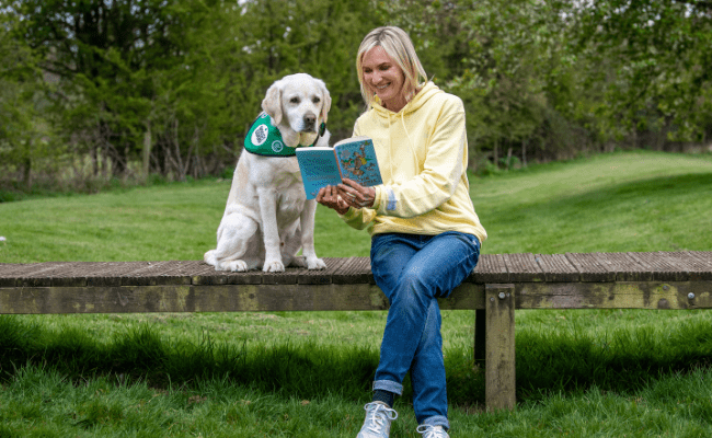 Jo Whiley reading to community dog Fleck
