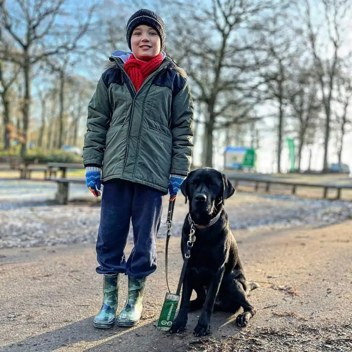 Autism Assistance Black Labrador Child Park Frontfacing Winter