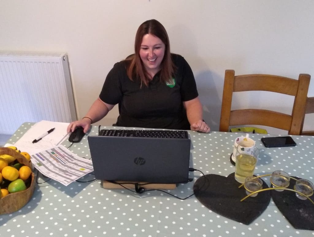 Hannah Beal, Family Dog Service Instructor at Dogs for Good pictured here doing a virtual session