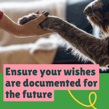 Human holding dog's paw with text 'Ensure your wishes are documented for the future'